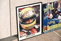 FRAMED PHOTOGRAPH: A framed photograph of Ayrton Senna (41cm x 51cm) together with a poster mounted on board of Vittorio coffee sponsoring the Osella team at the 1986 Australian Formula One Grand Prix (65 x 47cm) [Location: Sydney] - 2