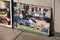 FRAMED PHOTOGRAPH: A framed photograph of Ayrton Senna (41cm x 51cm) together with a poster mounted on board of Vittorio coffee sponsoring the Osella team at the 1986 Australian Formula One Grand Prix (65 x 47cm) [Location: Sydney] - 3