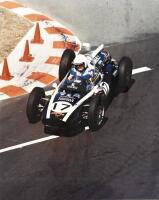 JACK BRABHAM: An unframed photograph of the Cooper T54 Indy Car by S M English signed by Jack Brabham and the photographer, 50cm x 64cm [Location: Sydney]