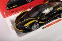 FERRARI FXX K:&nbsp;A 1:18 scale Ferrari FXX K, finished in black&nbsp;paintwork with yellow stripes, part of the signature series of models - 2