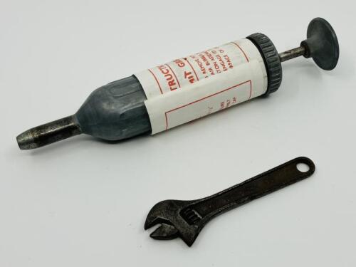 JAGUAR: An original grease gun and spanner, both tools from a 1950s/1960s era Jaguar tool kit [Location: Sydney]