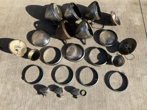 LUCAS HEADLAMPS: A collection of Lucas MB148 'King of the Road' headlamps from a 1950s Rover including five outer shells, plus three side lamps, three miscellaneous glass lenses and sundry bezels [Location: Sydney]
