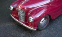 A nice 1950s&nbsp;Austin J40 (Junior) pedal car, maroon paintwork appears to be original with touch-ups with later electric headlamps fitted, 45cm high, approx 1.4m long [Location: Melbourne] - 2