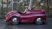 A nice 1950s&nbsp;Austin J40 (Junior) pedal car, maroon paintwork appears to be original with touch-ups with later electric headlamps fitted, 45cm high, approx 1.4m long [Location: Melbourne] - 7