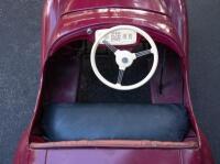 A nice 1950s&nbsp;Austin J40 (Junior) pedal car, maroon paintwork appears to be original with touch-ups with later electric headlamps fitted, 45cm high, approx 1.4m long [Location: Melbourne] - 11