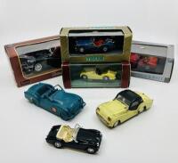 TRIUMPH: Seven die cast Triumph TR3 & TR3A models of various scales and makers, three in original boxes and three unboxed [Location: Sydney]