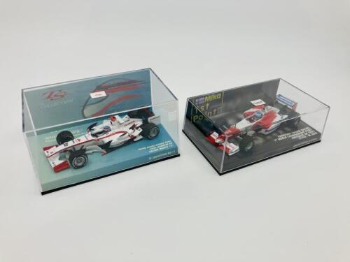 SUPER AGURI HONDA & TOYOTA RACING: Two Minichamps 1:43 scale models of Takuma Sato’s Super Aguri Honda SA05 and Mika Hakkinen’s Panasonic Toyota Racing TF102, boxed [Location: Sydney]