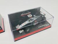 MCLAREN-MERCEDES: Two Minichamps 1:43 scale models of the McLaren Mercedes MP4-12 of David Coulthard and MP4-13 of David Coulthard, boxed [Location: Sydney] - 3