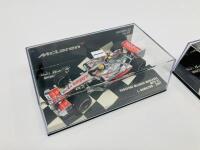 MCLAREN-MERCEDES: Two Minichamps 1:43 scale models of the Vodafone McLaren Mercedes MP4-22 of Lewis Hamilton (2007) and MP4-23 Kovalainen (2008) boxed [Location: Sydney] - 2