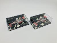 MCLAREN-MERCEDES: Two Minichamps 1:43 scale models of the Vodafone McLaren Mercedes MP4-22 of Lewis Hamilton (2007) and MP4-23 Kovalainen boxed (2008) [Location: Sydney]