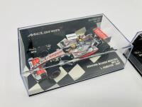 MCLAREN-MERCEDES: Two Minichamps 1:43 scale models of the Vodafone McLaren Mercedes MP4-22 of Lewis Hamilton (2007) and MP4-23 Kovalainen boxed (2008) [Location: Sydney] - 2