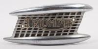 TRIUMPH: A circa 1950s or 1960s Triumph fuel tank badge [P/N OS4767], 8.5cm high, 22cm long [Location: Melbourne]