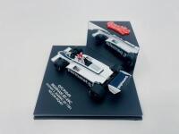 BRABHAM: A 1:43 scale model by Quartzo of the Brabham BT49C, winner of the 1981 San Marino Grand Prix, driven by Nelson Piquet, complete with plinth and display case [Location: Sydney] - 3