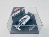 BRABHAM: A 1:43 scale model by Quartzo of the Brabham BT49C, winner of the 1981 San Marino Grand Prix, driven by Nelson Piquet, complete with plinth and display case [Location: Sydney] - 4