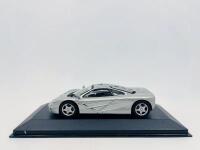 MCLAREN: A 1:43 scale model by Minichamps of the McLaren F1 in silver, complete with original packaging [Location: Sydney]