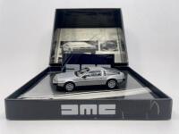 DMC: A 1:43 scale model by Minichamps&nbsp;of the 1981 DMC Delorean, limited edition 0261/9.999&nbsp;complete with original packaging.&nbsp;