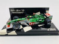 Jaguar: A 1:43 scale model by Minichamps of the Jaguar Racing R5 Formula One in Mark Webber livery, in original packaging [Location: Sydney]