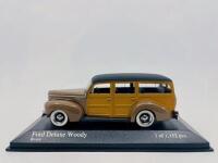 FORD: A 1:43 scale model by Minichamps of the 1940&nbsp;Ford DeLuxe Woody in brown. Limited edition, 1 of 1,152 pieces,&nbsp;complete with original packaging [Location: Sydney]