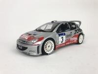 PEUGEOT: Three 1:18 scale Peugeot rally cars produced by AutoArt (NB description) - 10