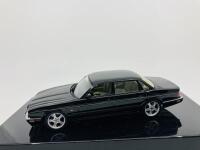 Jaguar: A 1:43 scale model by AutoArt of the XJR in Black, in original packaging [Location: Sydney]