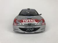 PEUGEOT: Three 1:18 scale Peugeot rally cars produced by AutoArt (NB description) - 12