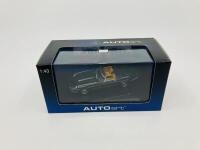 Jaguar: A 1:43 scale model by AutoArt of the E-type Series 3 V12 Roadster in Green, in original packaging [Location: Sydney] - 2