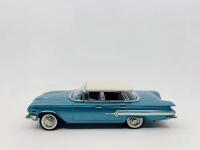 CHEVROLET: A 1:43 scale model by Brooklin Models of the 1960 Chevrolet Impala 4-Door Hardtop Sport Sedan in Tasco Turquoise and Ermine White, complete with original packaging [Location: Sydney]
