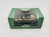 Aston Martin: A 1:43 scale model by Oxford of the Vanquish Coup&eacute; in Selene Bronze,&nbsp;in original packaging [Location: Sydney] - 2