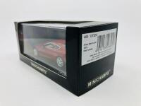 Aston Martin: A 1:43 scale model by Minichamps of the DB9 in Toro Red, in original packaging [Location: Sydney] - 3