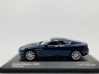 Aston Martin: A 1:43 scale model by Minichamps of the DB9 in Midnight Blue, in original packaging [Location: Sydney]