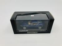 Aston Martin: A 1:43 scale model by Minichamps of the DB9 in Midnight Blue, in original packaging [Location: Sydney] - 2