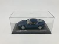 Aston Martin: A 1:43 scale model by Minichamps of the DB9 in Midnight Blue, in original packaging [Location: Sydney] - 4