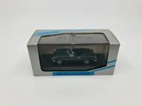 M.G.: A 1:43 scale model by Minichamps of the 1962-1969 MGB Roadster in BRG, in original packaging [Location: Sydney] - 2