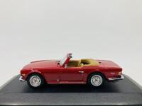 Triumph: A 1:43 scale model by Minichamps of the TR6, in original packaging [Location: Sydney]