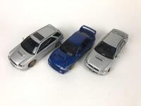 SUBARU: Three 1:18 scale Subaru Impreza's models produced by AutoArt (NB description) - 2