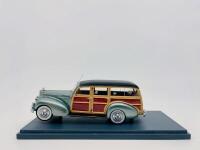 PACKARD: A 1:43 scale model by Neo Scale Models of the Packard 110 Deluxe Wagon in green, complete with original packaging [Location: Sydney]