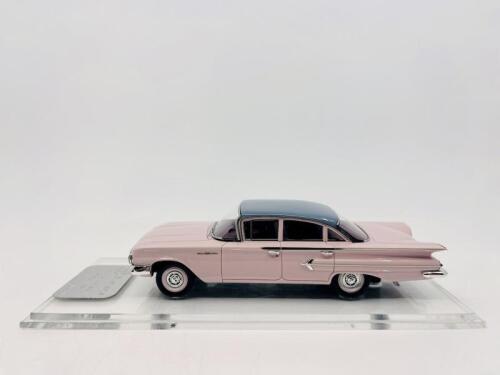 CHEVROLET: A 1:43 scale model by Trax of the 1960 Chevrolet Bel Air Sedan in two tone pink and blue. Limited edition 370/415 pieces, complete with original packaging [Location: Sydney]