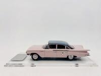 CHEVROLET: A 1:43 scale model by Trax of the 1960 Chevrolet Bel Air Sedan in two tone pink and blue. Limited edition 370/415 pieces, complete with original packaging [Location: Sydney]