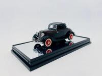 FORD: A 1:43 scale model by Classic Carlectables of the 1933 Ford V8 Coupe, limited edition 0424/2500, complete with original packaging and certificate of authenticity. [Location: Sydney] - 2
