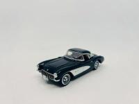 CHEVROLET: A 1:43 scale model by Road Signature of the 1957 Chevrolet Corvette convertible in white, complete with original packaging [Location: Sydney] - 2