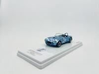 SHELBY: A 1:43 scale model by TSM Model of the 1964 Shelby Cobra, driven by Phill Hill and Bob Bondurant in the 1964 Targa&nbsp;Florio,&nbsp;complete with original packaging [Location: Sydney] - 2