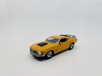 FORD: A 1:43 scale model by Matchbox of the 1970 Ford Mustang 429 Boss Coupe in yellow.&nbsp;[Location: Sydney] - 2