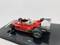 FERRARI: A 1:43 scale model by Hot Wheels of the 312 T2, in original packaging [Location: Sydney] - 5