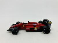 FERRARI: A 1:43 scale model by Hot Wheels of the F1-87,&nbsp;in original packaging [Location: Sydney]