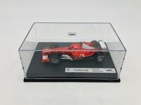 FERRARI: A 1:43 scale model by Hot Wheels of the F2003-GA, in original packaging [Location: Sydney] - 3