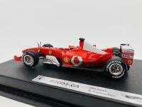 FERRARI: A 1:43 scale model by Hot Wheels of the F2003-GA, in original packaging [Location: Sydney] - 5