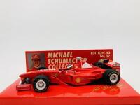 FERRARI: A 1:43 scale model by Minichamps of the F300&nbsp;in Michael Schumacher livery, in original packaging [Location: Sydney]