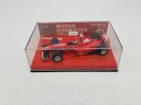 FERRARI: A 1:43 scale model by Minichamps of the F300&nbsp;in Michael Schumacher livery, in original packaging [Location: Sydney] - 2