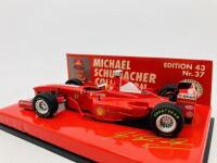 FERRARI: A 1:43 scale model by Minichamps of the F300&nbsp;in Michael Schumacher livery, in original packaging [Location: Sydney] - 4
