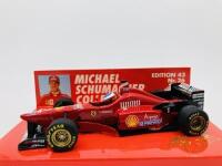 FERRARI: A 1:43 scale model by Minichamps of the F310 in Michael Schumacher livery, in original packaging [Location: Sydney]